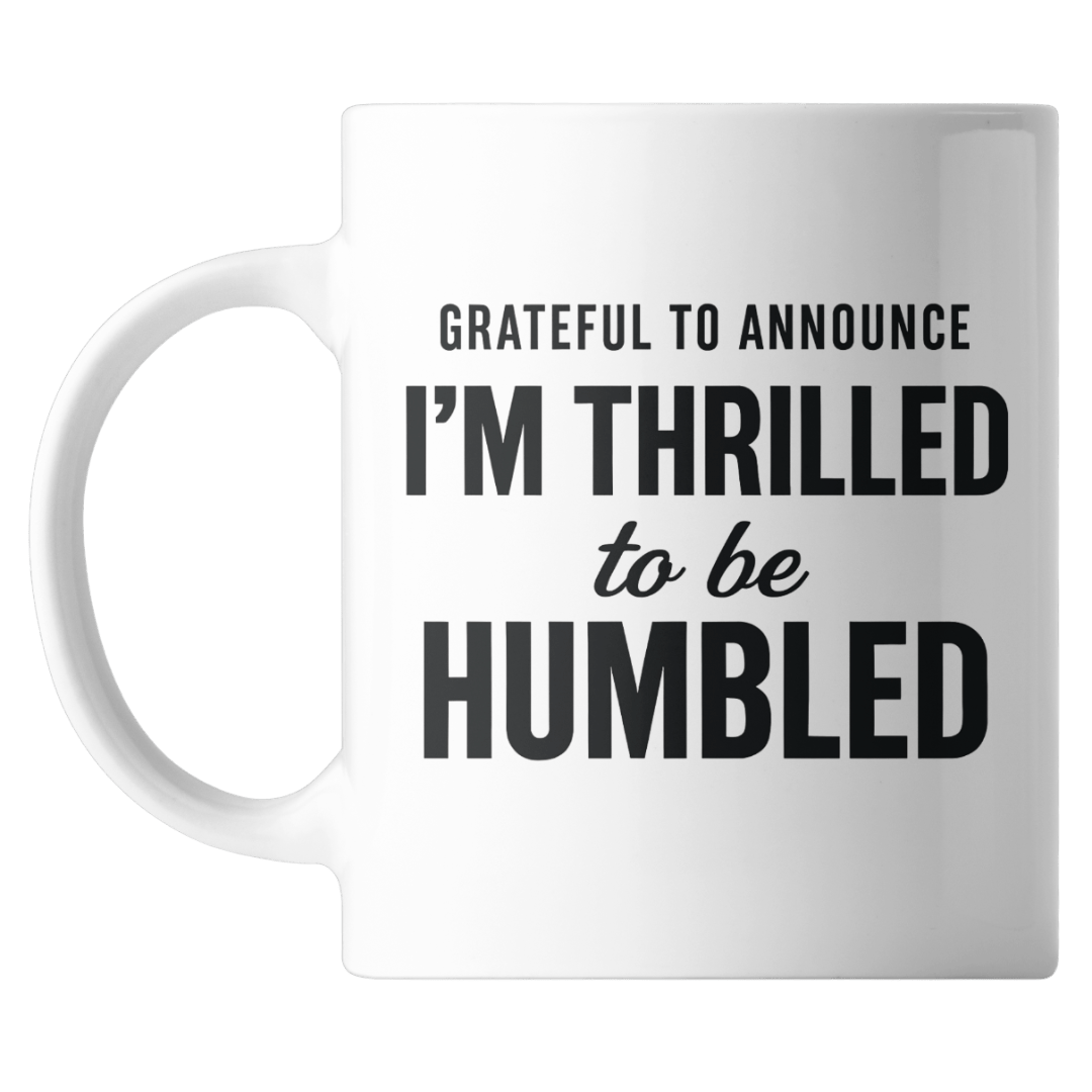 White mug with black text on a white background