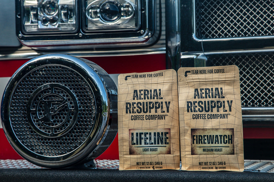 Bags of Lifeline and Firewatch coffee from Aerial Resupply Coffee on the bumper of a fire engine