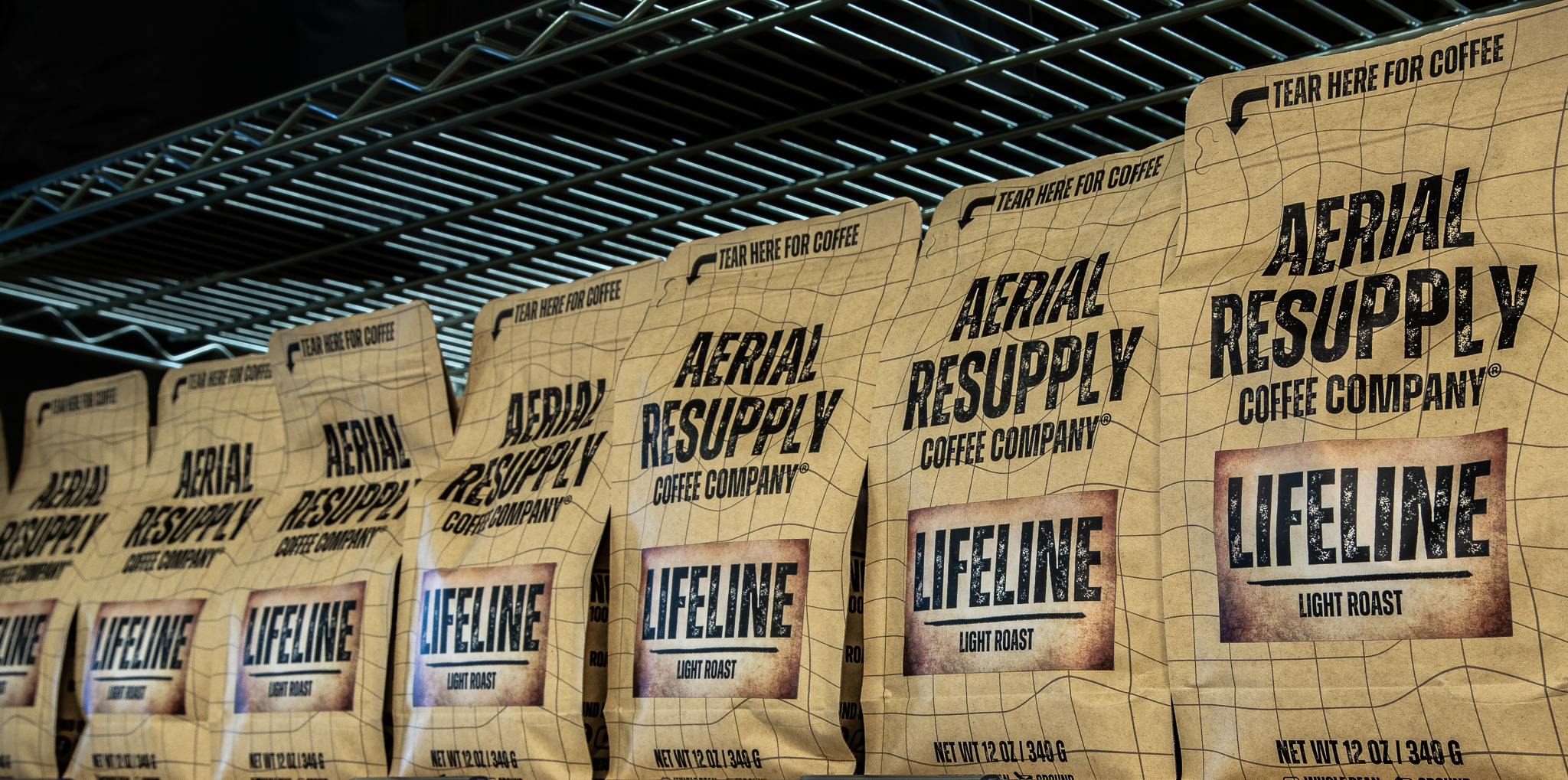 Aerial Resupply Coffee lifeline light roast coffee bags in a line in our store in Charlottesville Virginia
