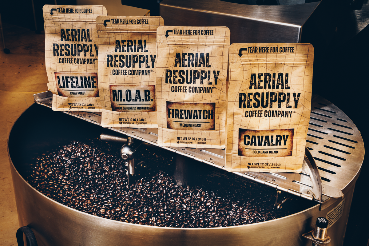 Bags of Lifeline, MOAB, Firewatch and Cavalry coffee on the cooling tray of the roaster in Charlottesville