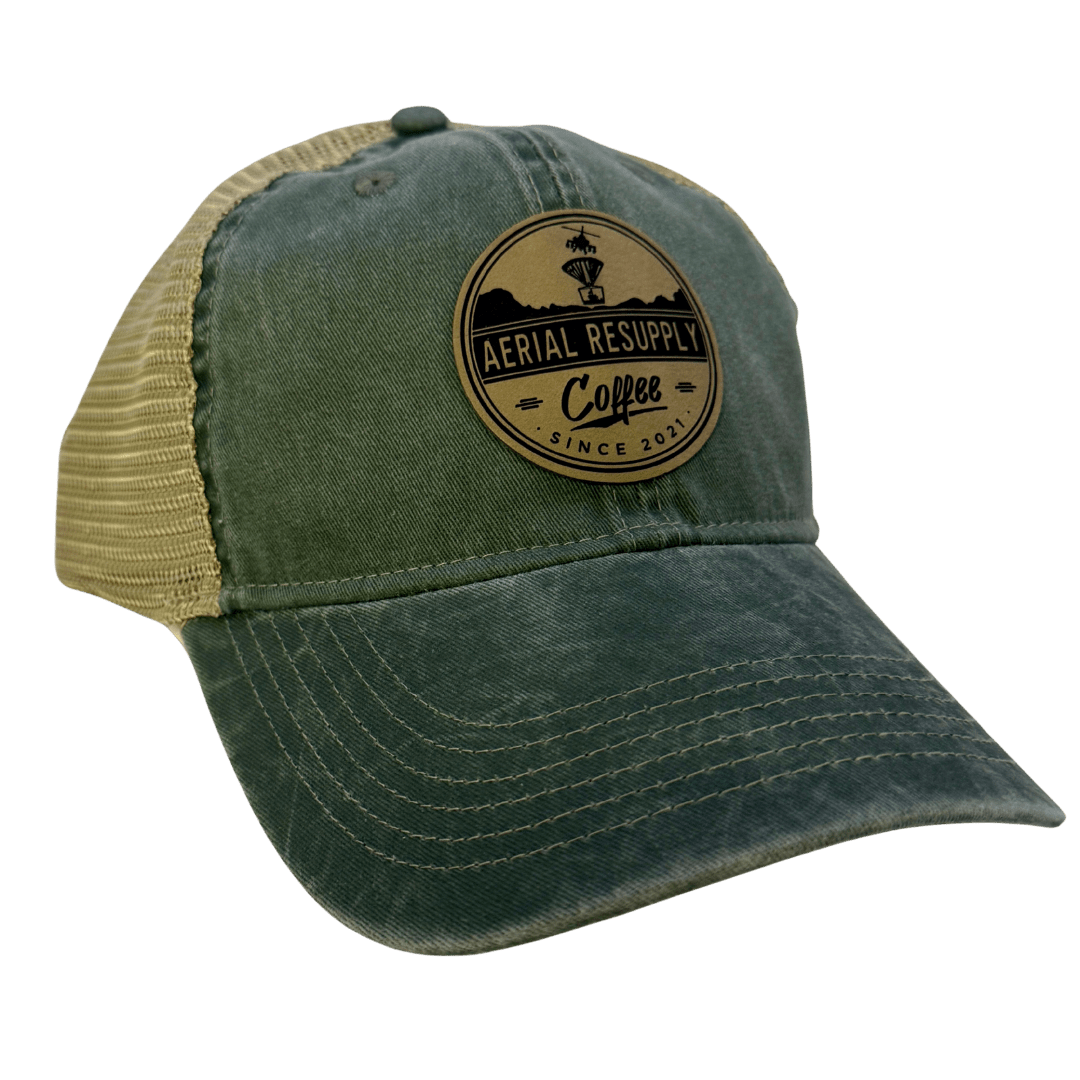 Green and tan hat with a patch