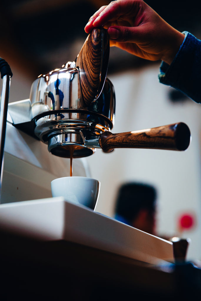 Coffee on dark espresso cup aerial resupply coffee