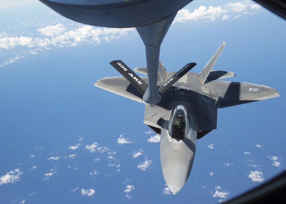 F22 Raptor Flying Over Hawaii being refueled by a KC-135 