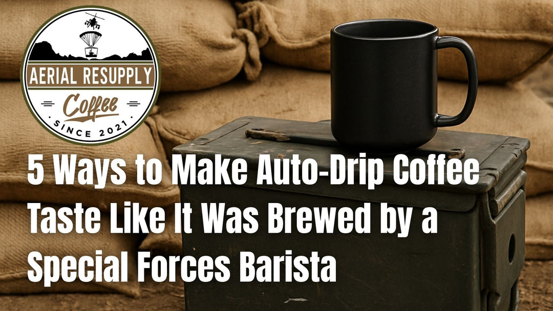 A cup of coffee on an ammo can in front of sand bags in an desert environment