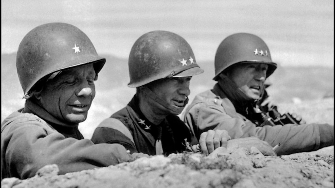 Generals Patton and Bradley overlooking an enemy position