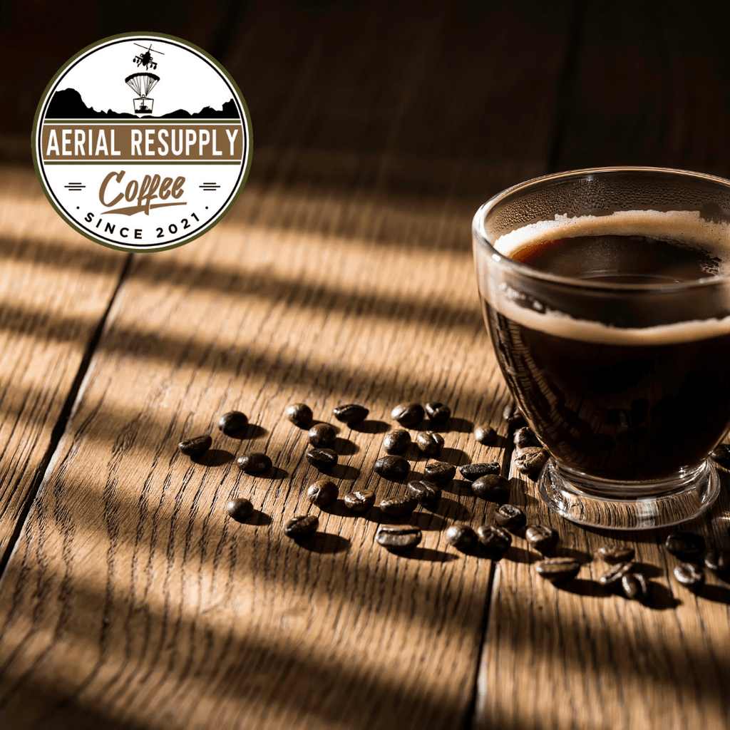 Black coffee on wood grain with whole beans Aerial Resupply Coffee