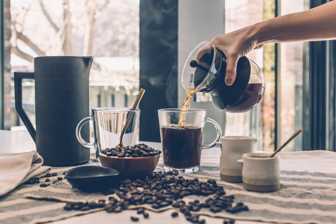 Hot coffee being poured into a cup