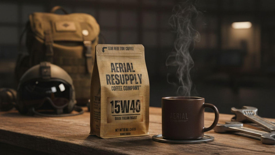 Aerial Resupply Coffee 15W40 Dark Italian Roast bag and steaming mug on a military workbench with a flight helmet and rucksack