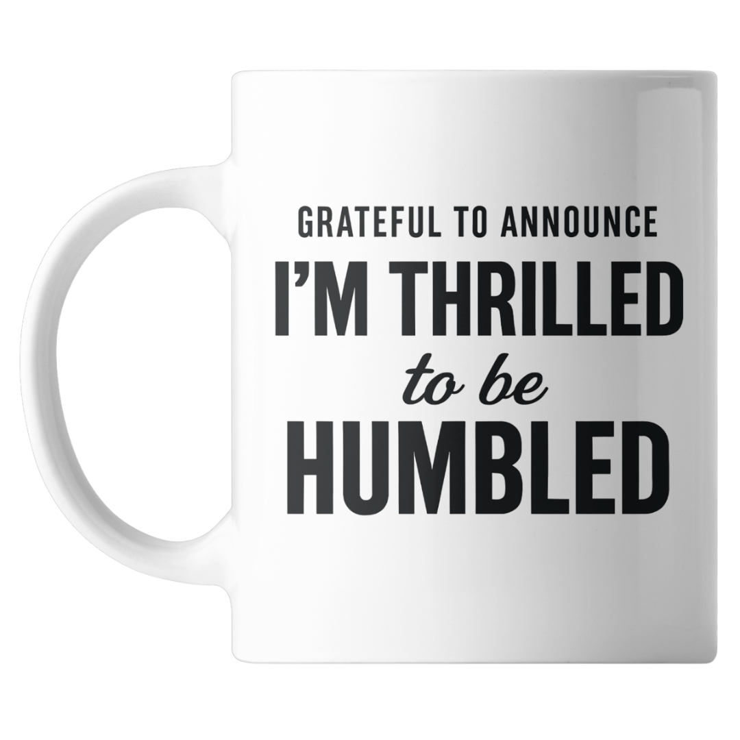 White mug with black text on a white background