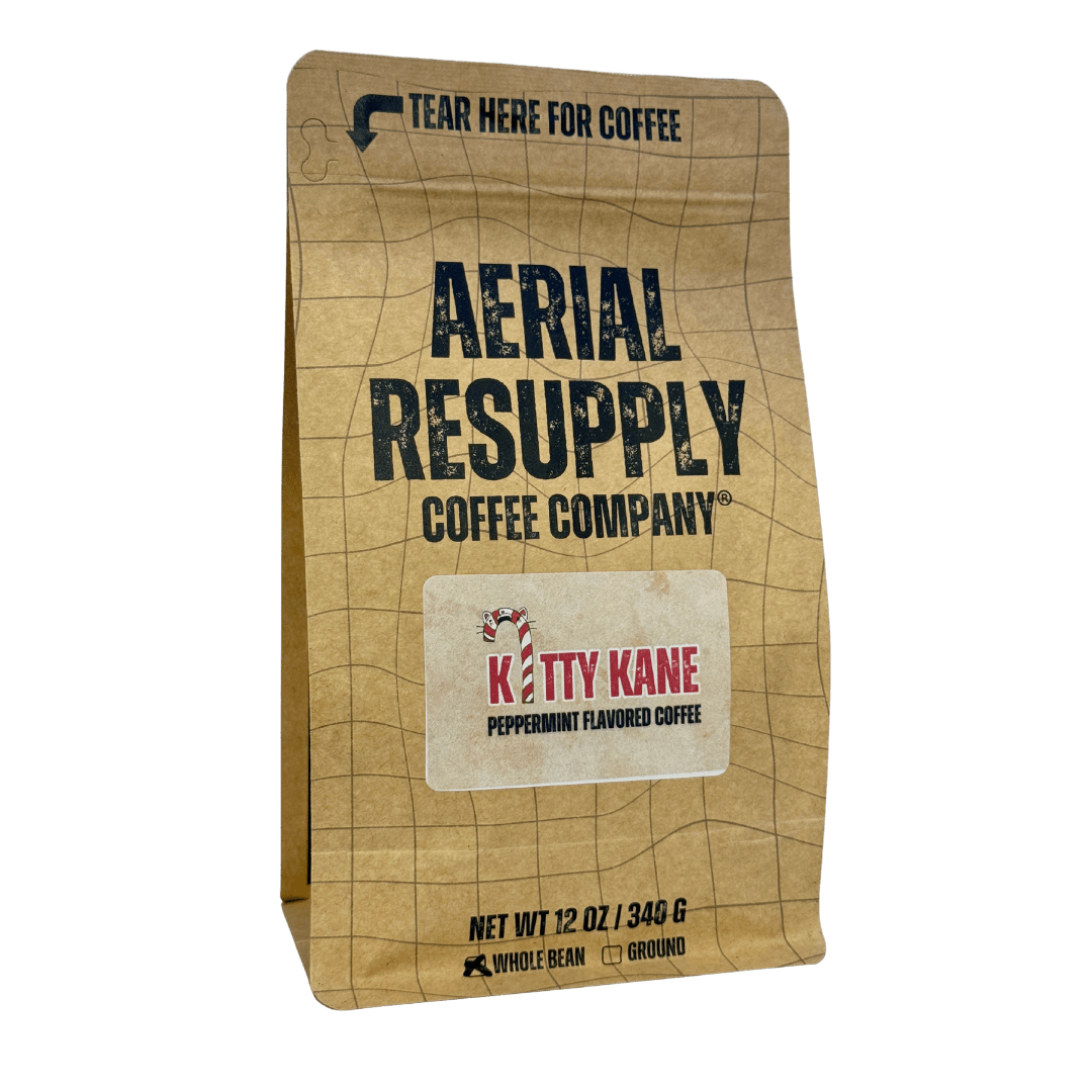 Kraft paper coffee bag with 'Aerial Resupply Coffee Company' branding and a smaller label for 'Kitty Kane Peppermint Flavored Coffee'.