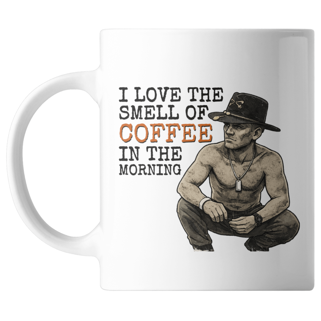 Mug with a graphic of a shirtless man wearing a hat and text 'I love the smell of coffee in the morning' on a white background.