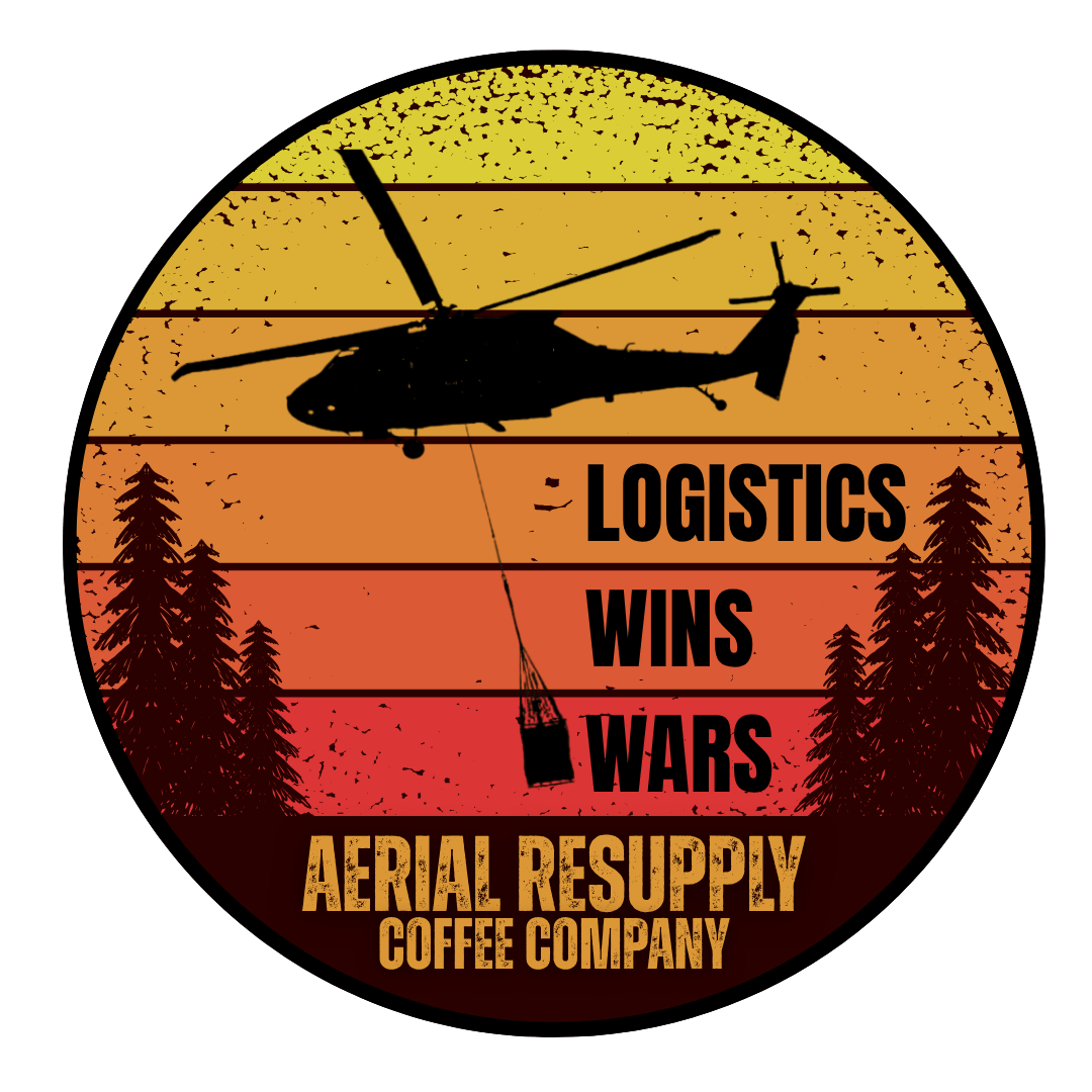 Sunset colored circle sticker with a helicopter and trees and black words that say logistics wins wars
