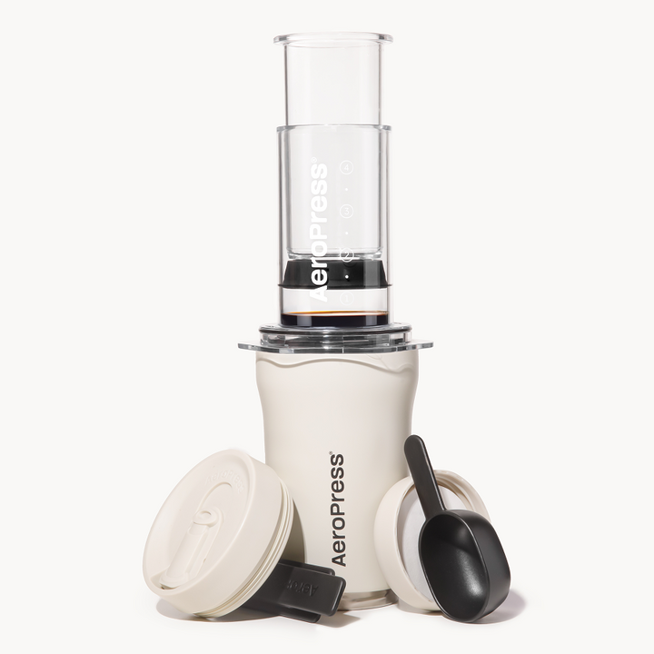 AeroPress Go Plus in cream on a white background