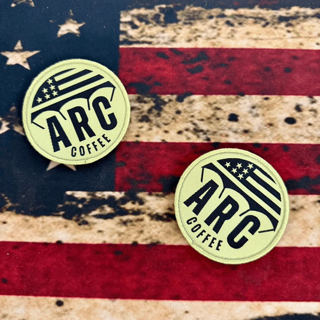 two aerial resupply coffee velcro embroidered patches on an american flag