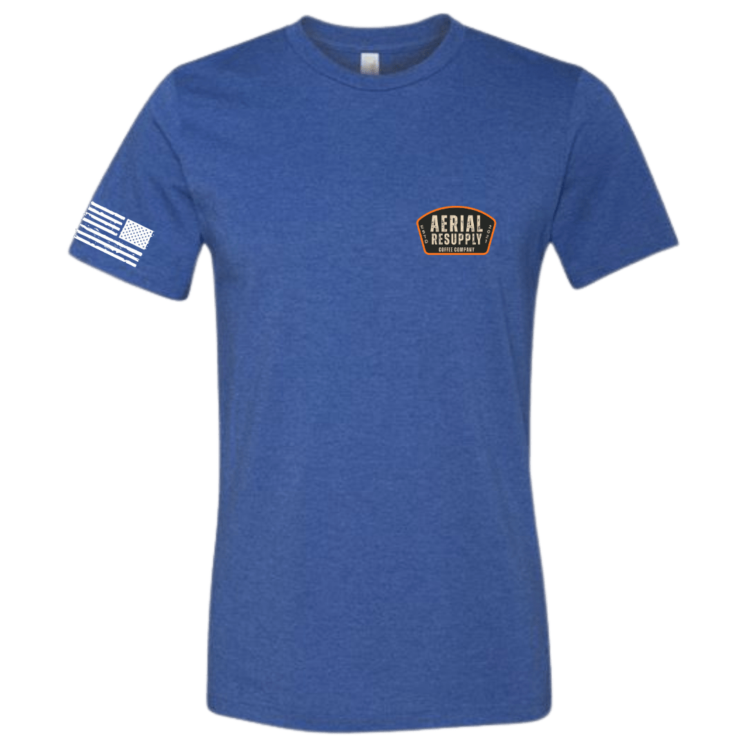 Blue t-shirt with a logo and flag on a white background