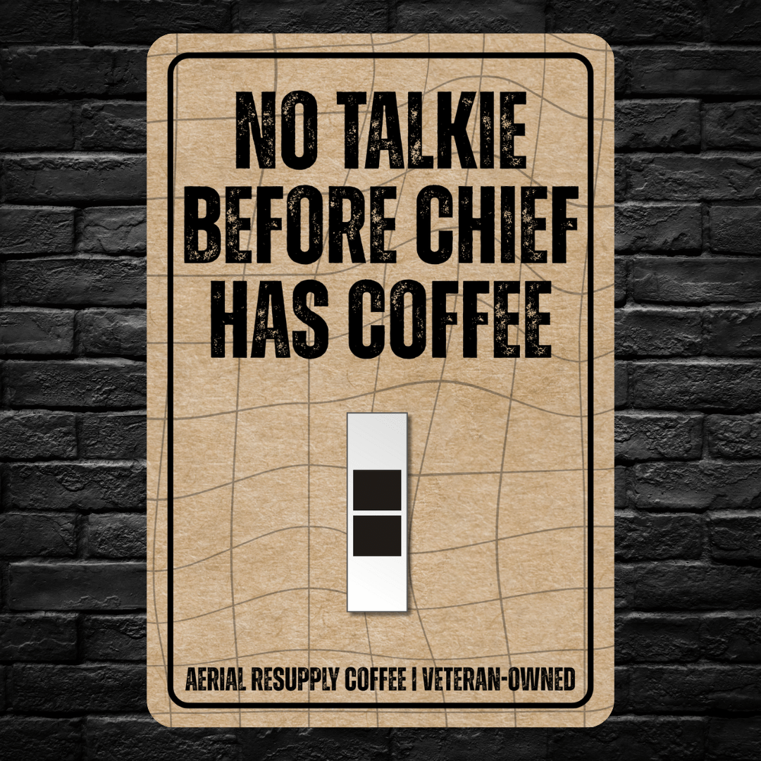 Light switch cover with 'No Talkie Before Chief Has Coffee' text on a brick wall background