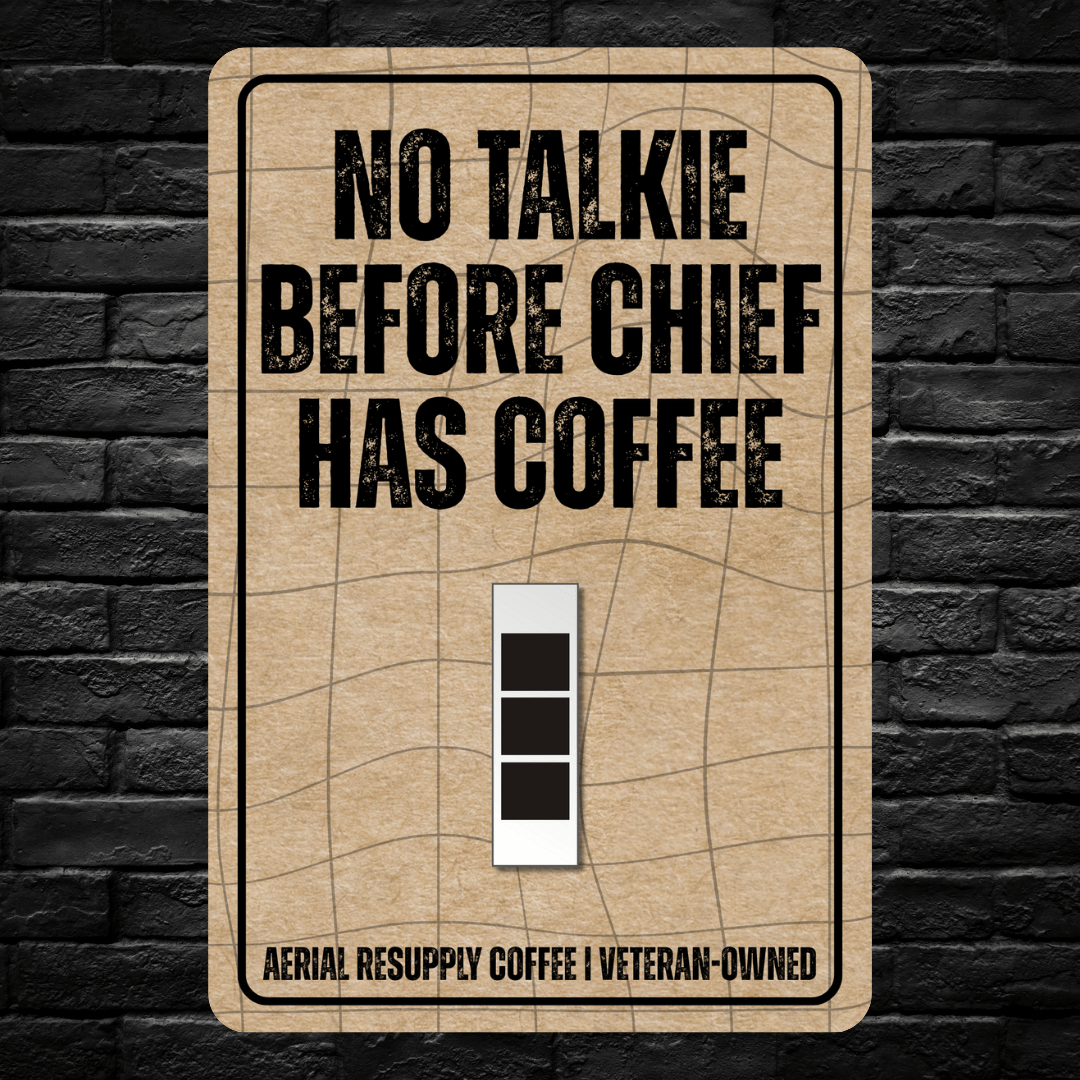 Light switch cover with 'No Talkie Before Chief Has Coffee' text on a brick wall background