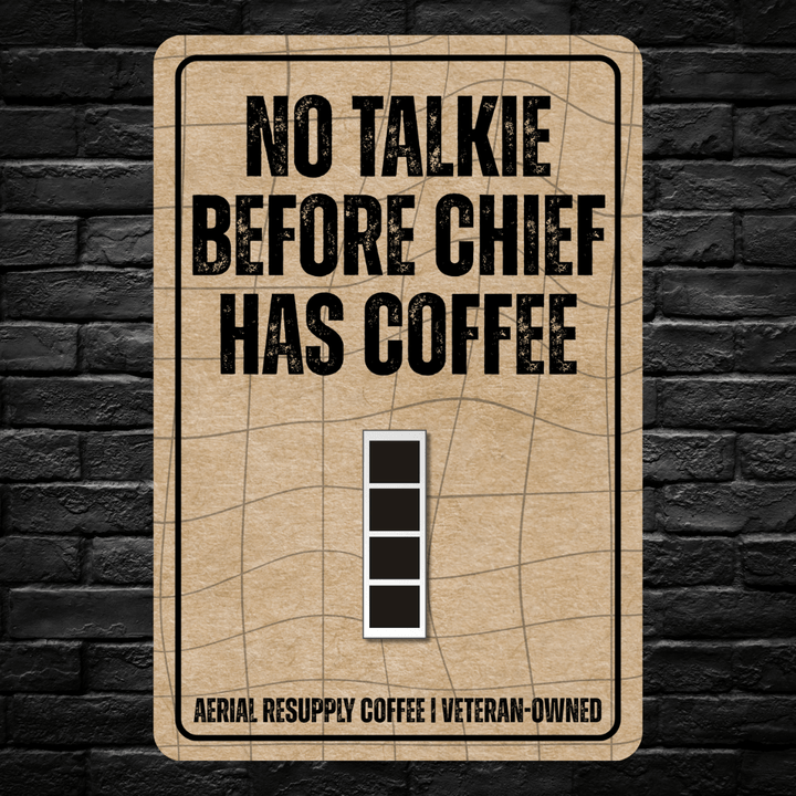 Sign with text 'No Talkie Before Chief Has Coffee' on a brick wall background