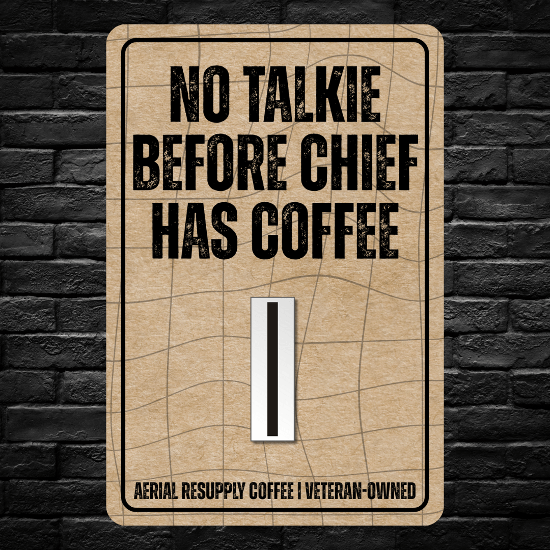 Sign with text 'No Talkie Before Chief Has Coffee' on a brick wall background