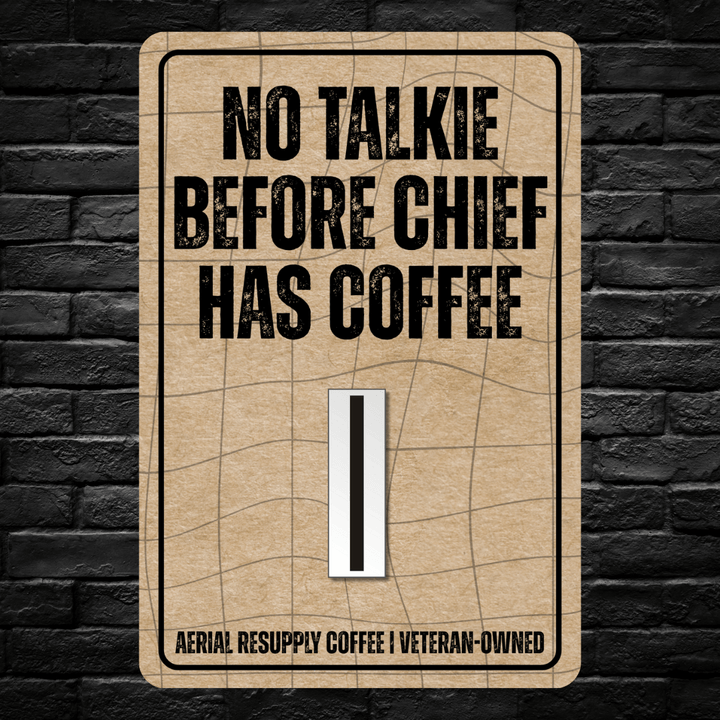 Sign with text 'No Talkie Before Chief Has Coffee' on a brick wall background