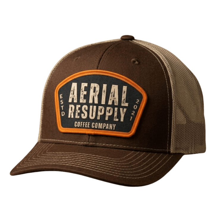 Brown cap with 'Aerial Resupply Coffee Company' patch on a white background