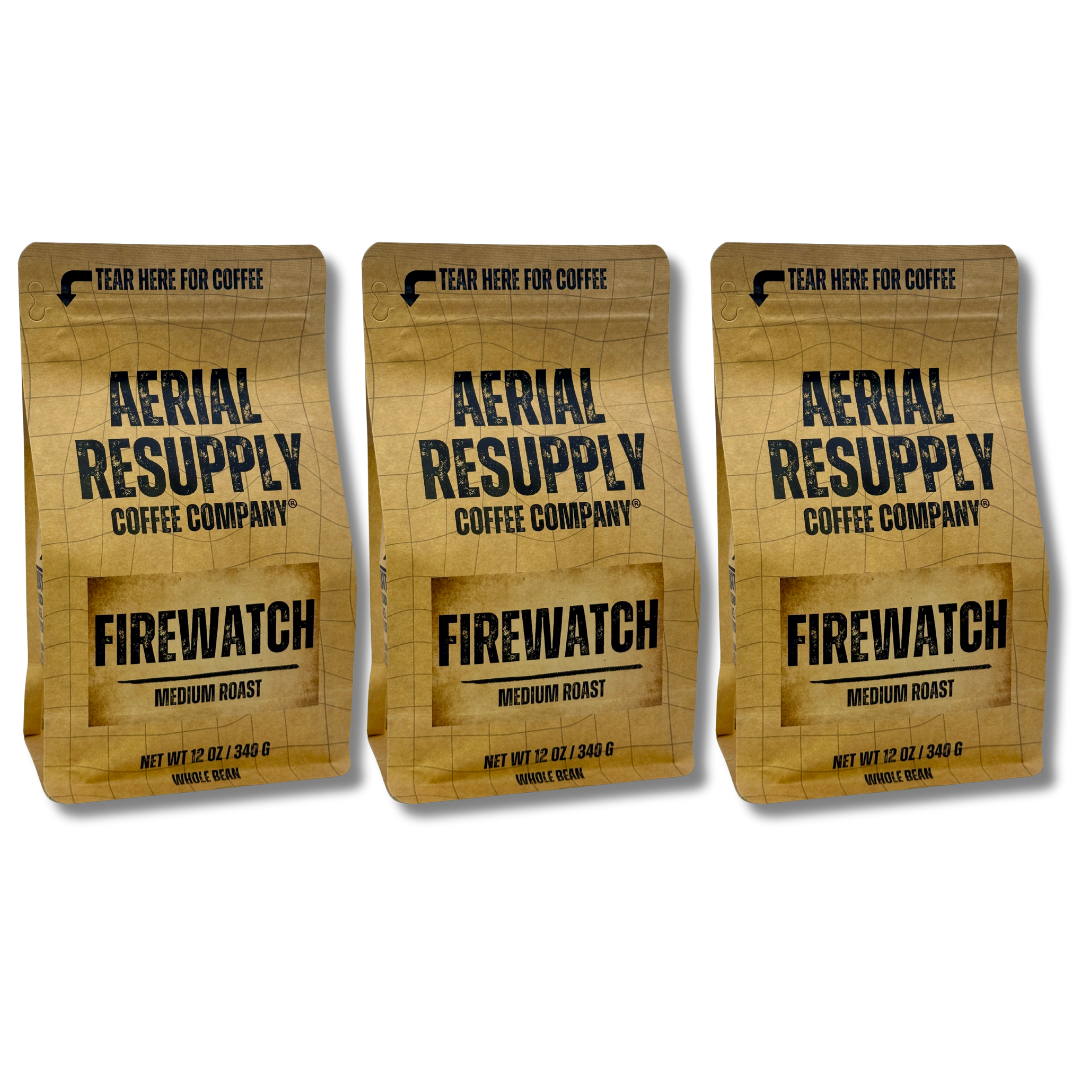 Three packages of Aerial Resupply Coffee Company Firewatch Medium Roast coffee on a white background.
