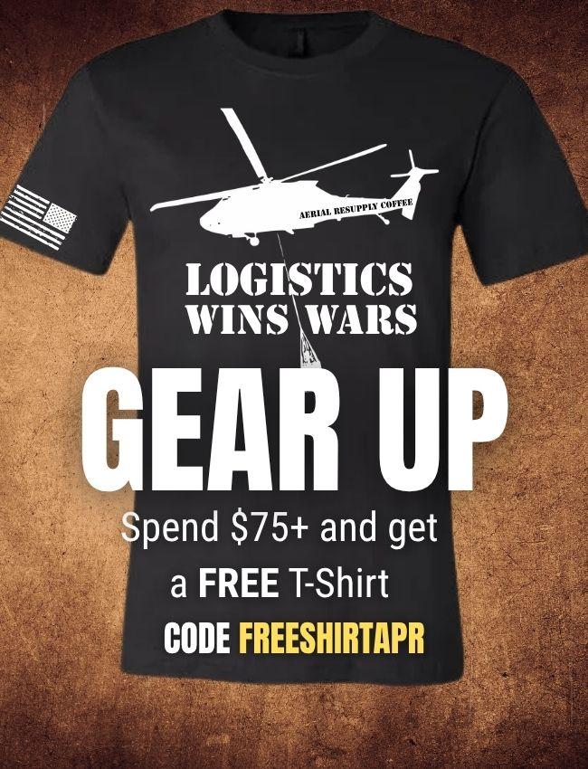 Black t-shirt with helicopter graphic and promotional text on a brown background