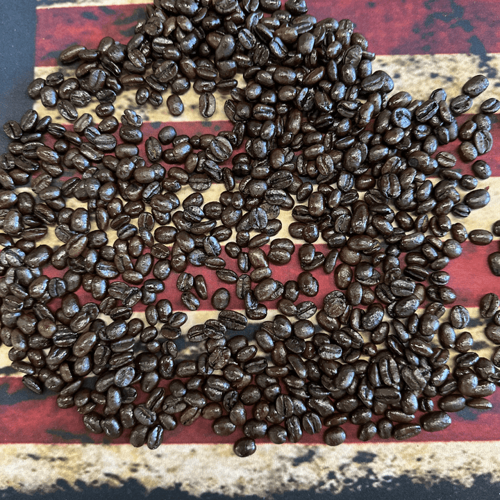 Spectre Dark Espresso Roast whole bean and preground premium coffee from Aerial Resupply Coffee on an American Flag.